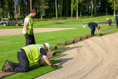 Golf course construction hand laying turf Heythrop Park