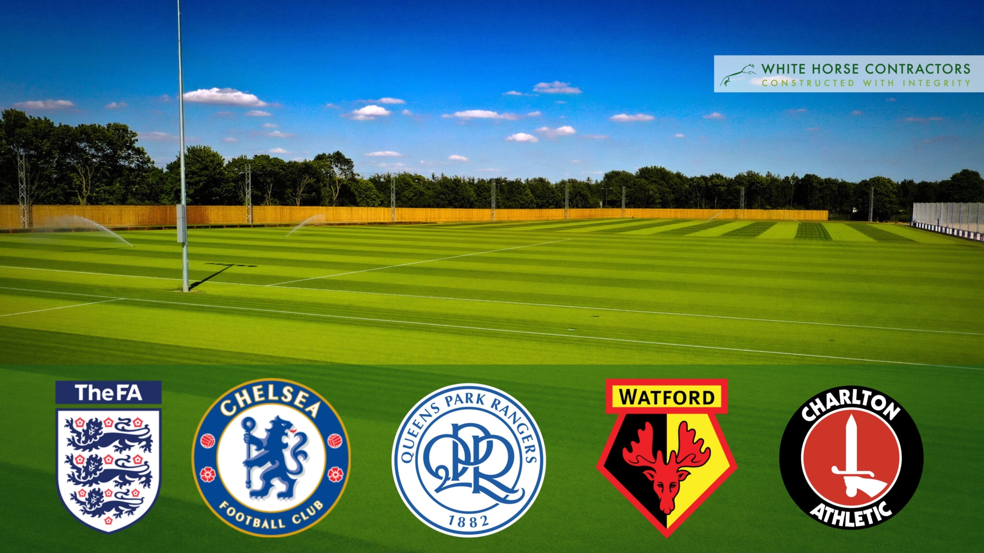 Training ground with logos of the Football Association, Chelsea F.C., Portsmouth F.C., Queens Park Rangers F.C., Watford F.C., Charlton Athletic F.C.